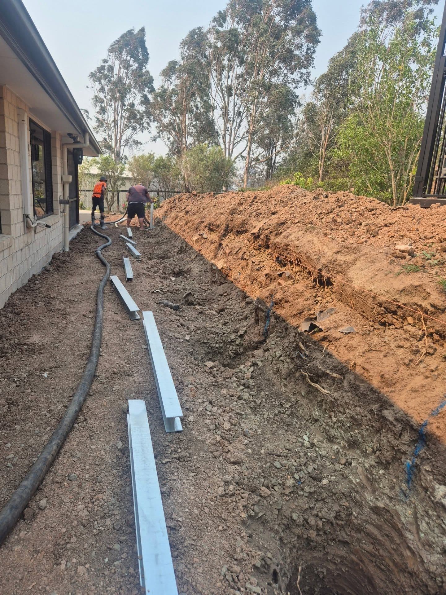A finished concrete sleeper retaining wall in Springfield