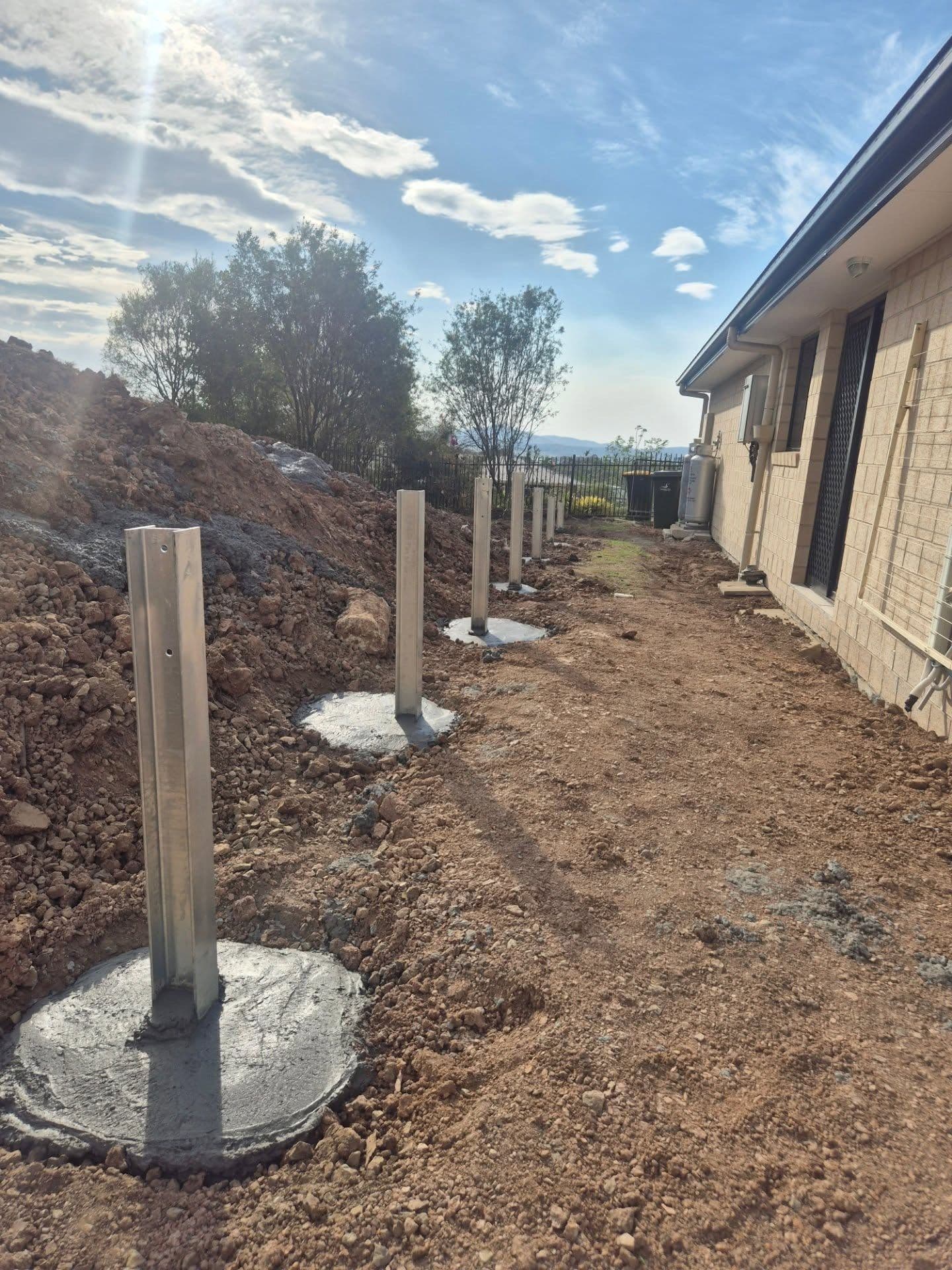 Galvanised posts set and concreted before the sleepers go in