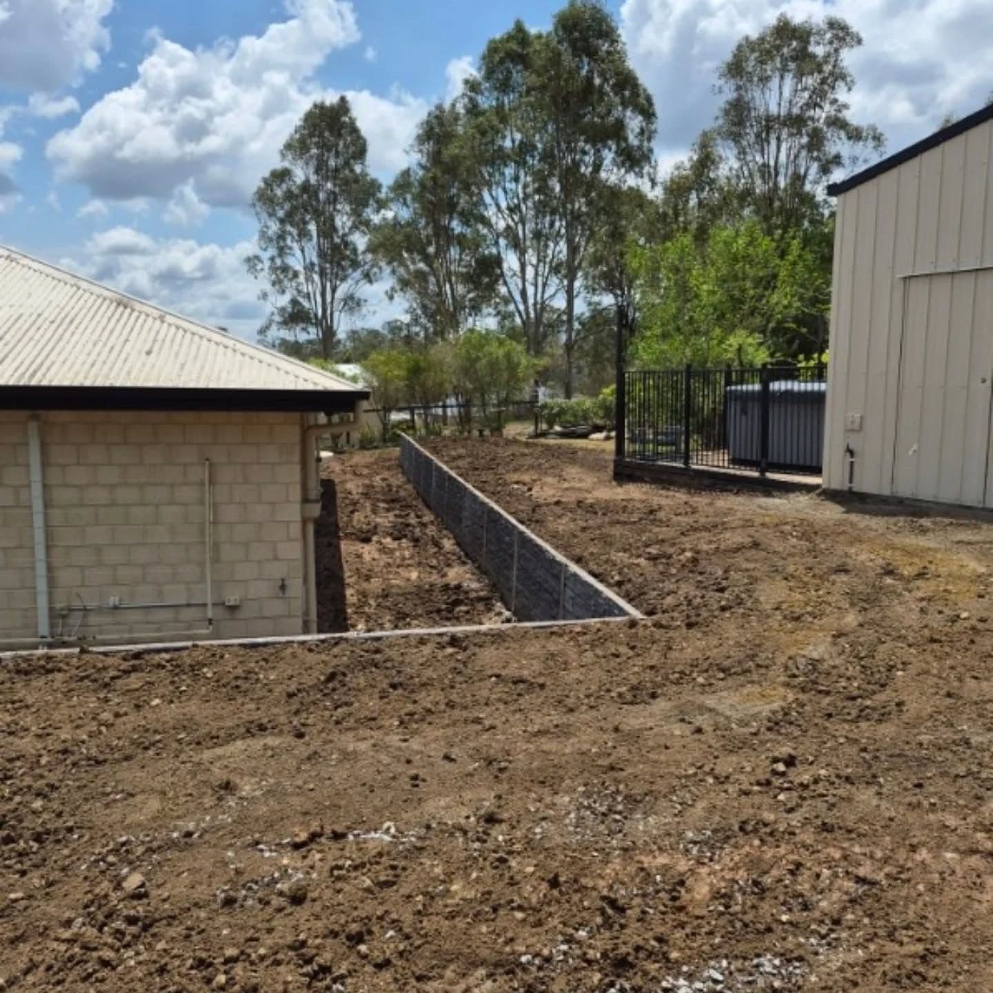 Finished wall holding a shed pad