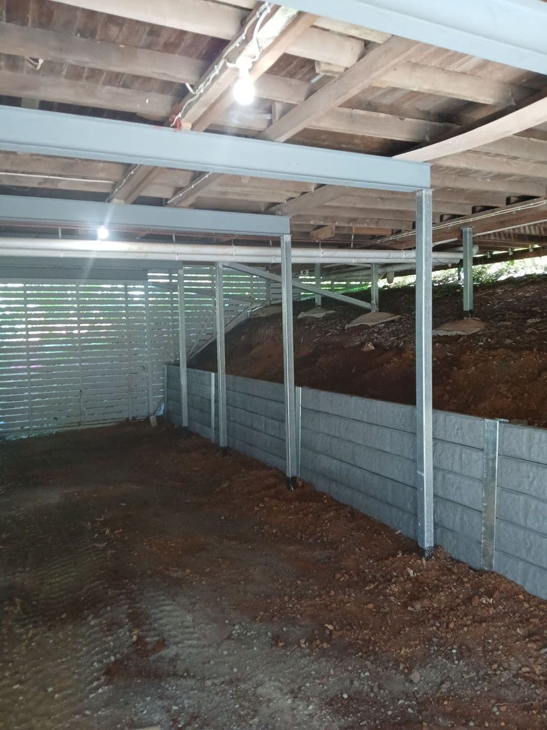 A Bedrock Charcoal concrete sleeper retaining wall we built