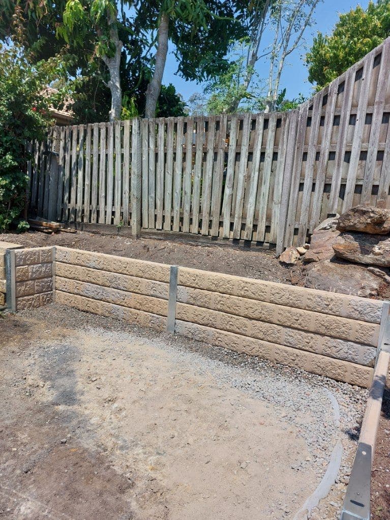 A Bedrock Sandstone concrete sleeper retaining wall we built
